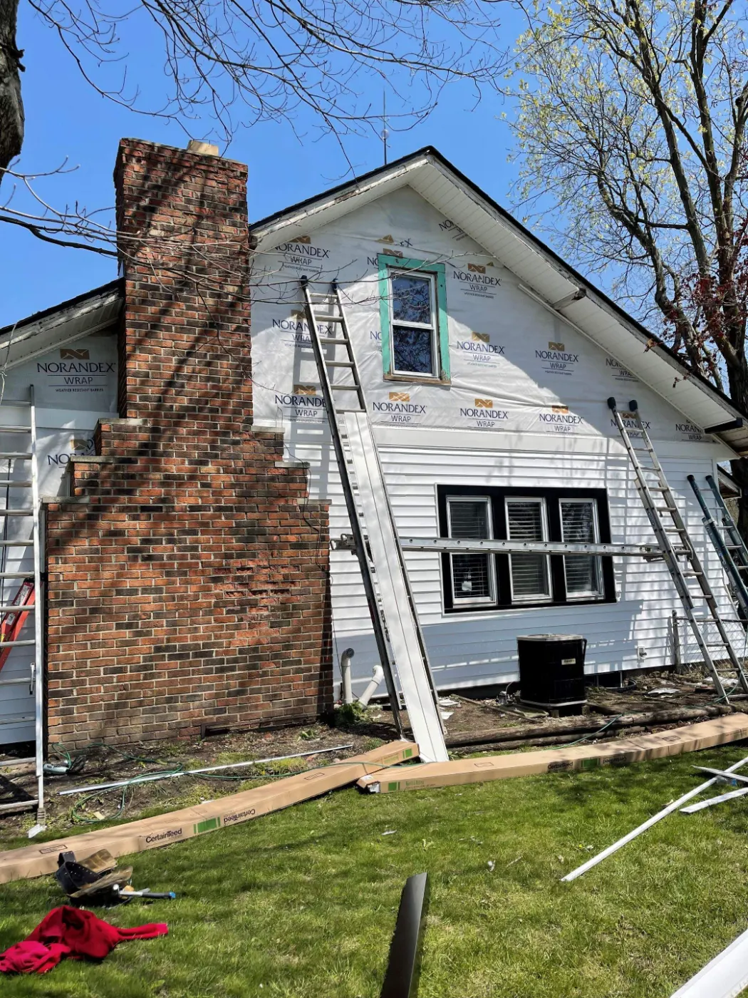 Siding installation documented in Maple Knoll